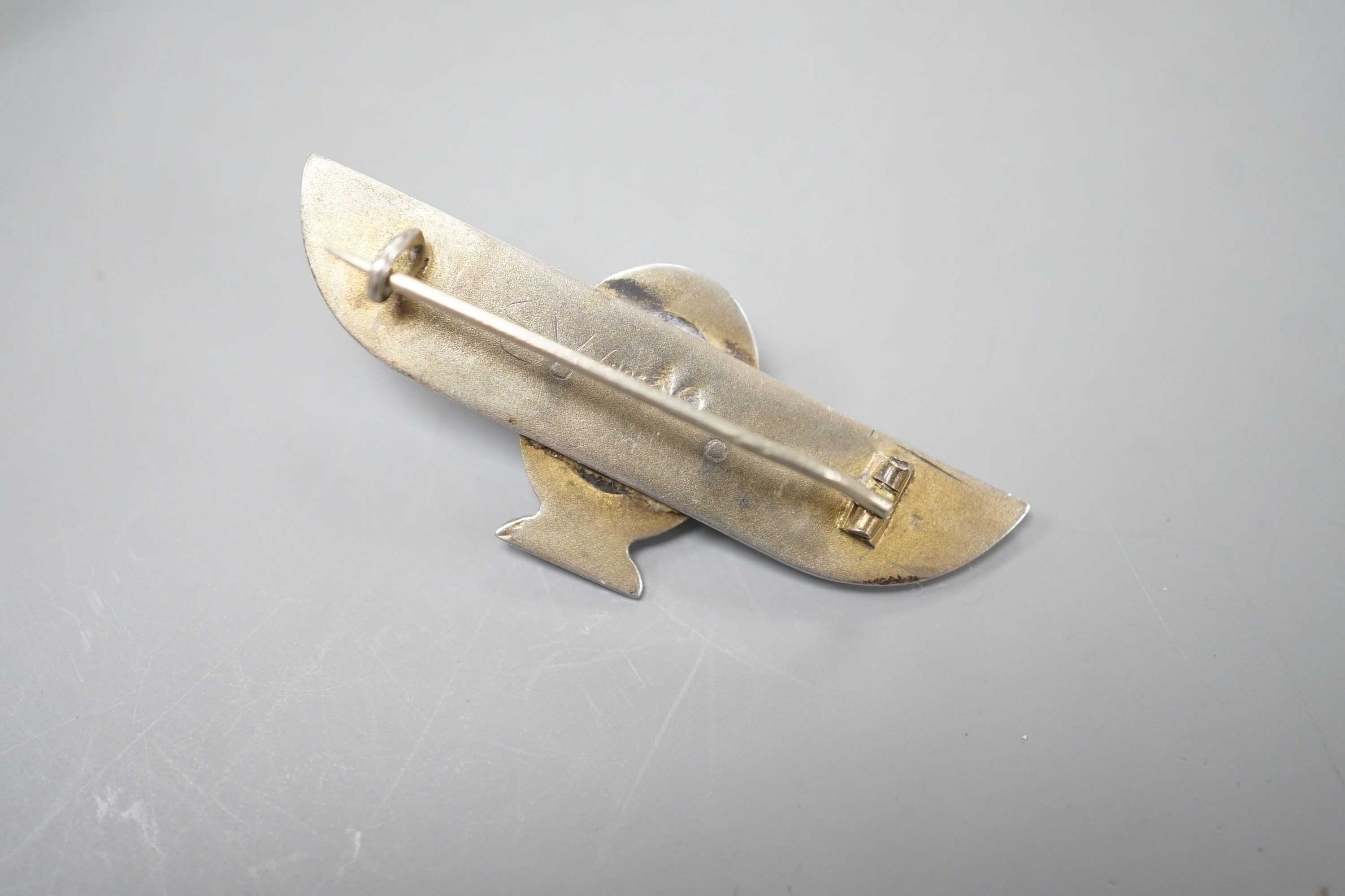 A German 800 standard white metal and 'scarab' set winged bar brooch, 48mm.